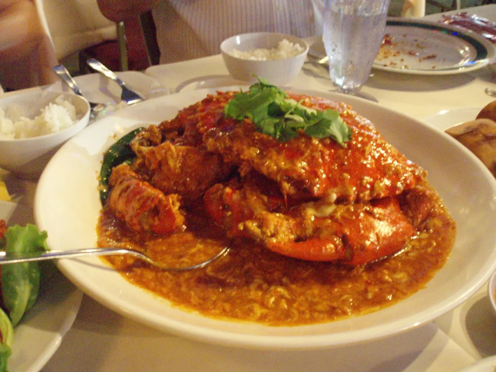 Singapore chilli crab coated in a red tomato and chilli sauce.