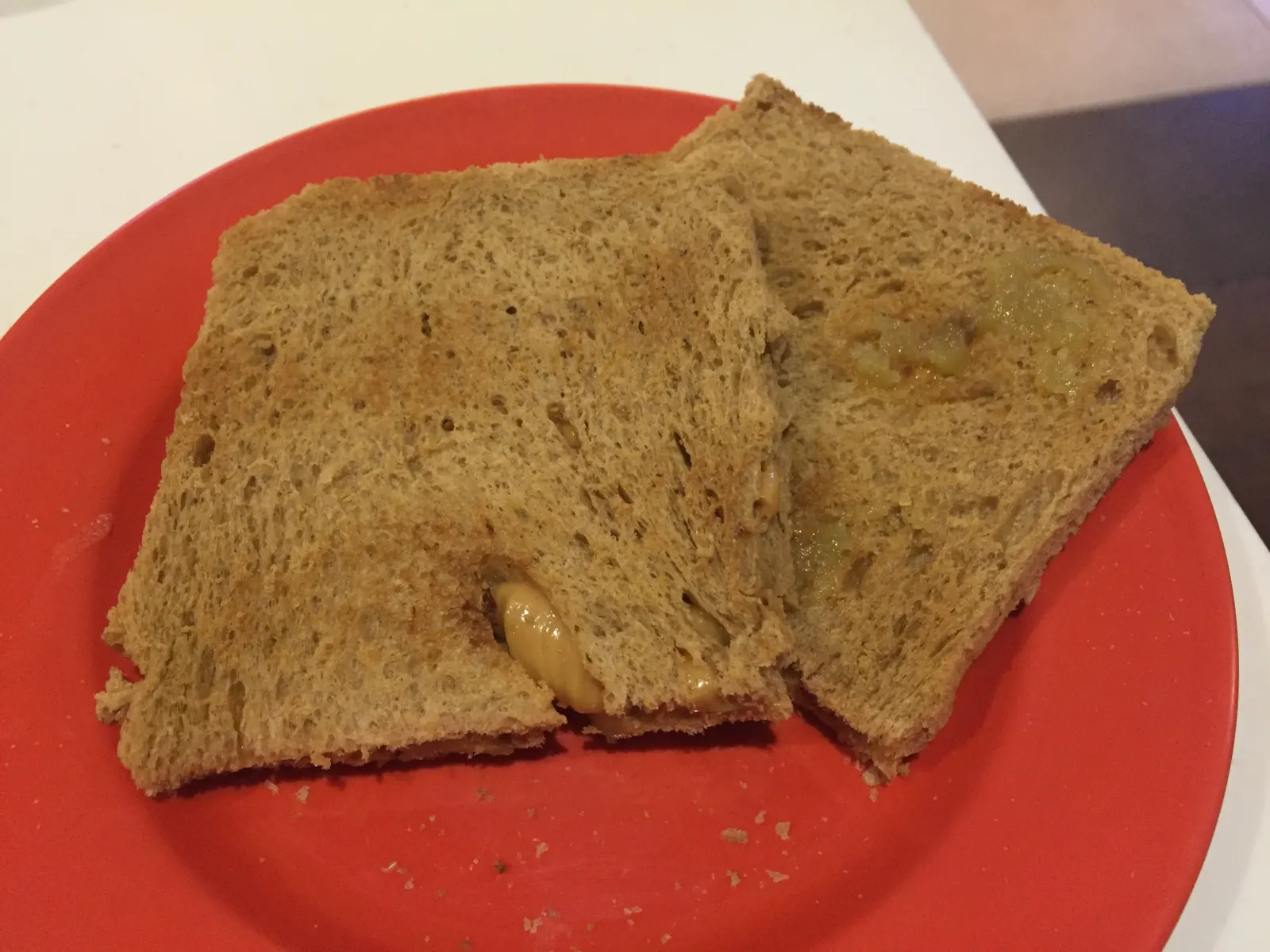 Slices of kaya toast served on a plate in Singapore.