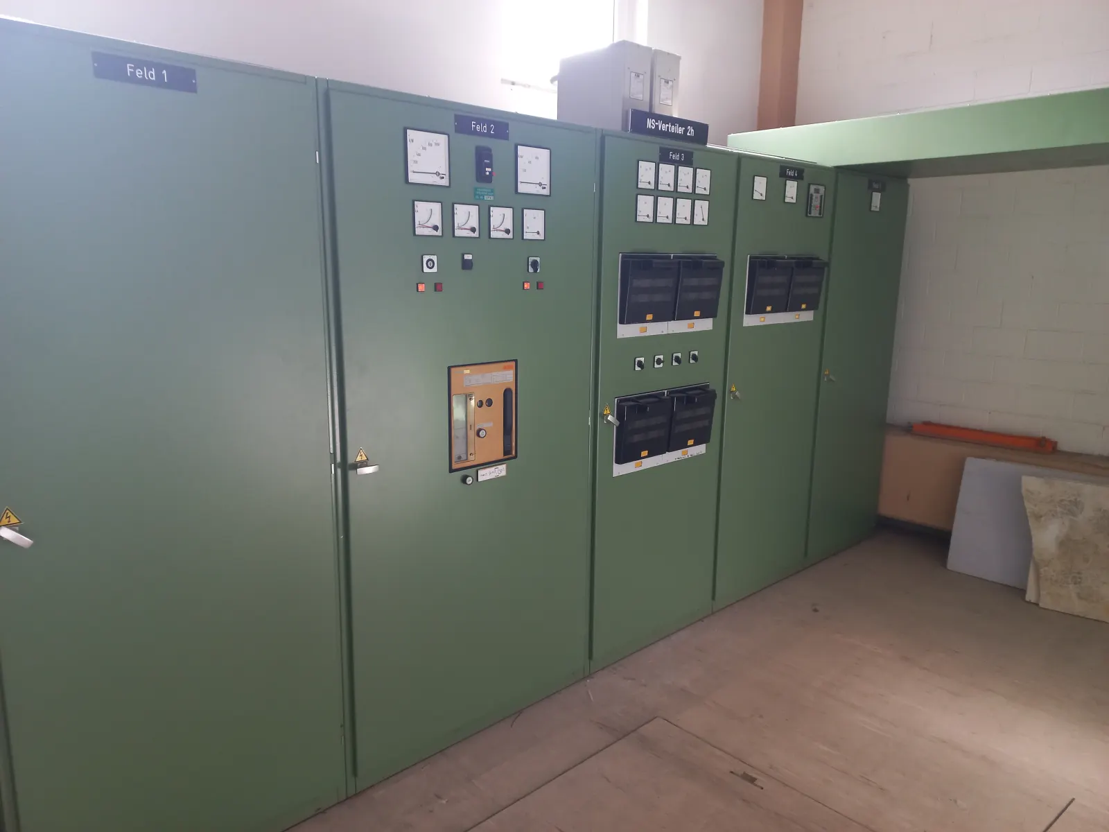 An electrical distribution board with switches and wiring.