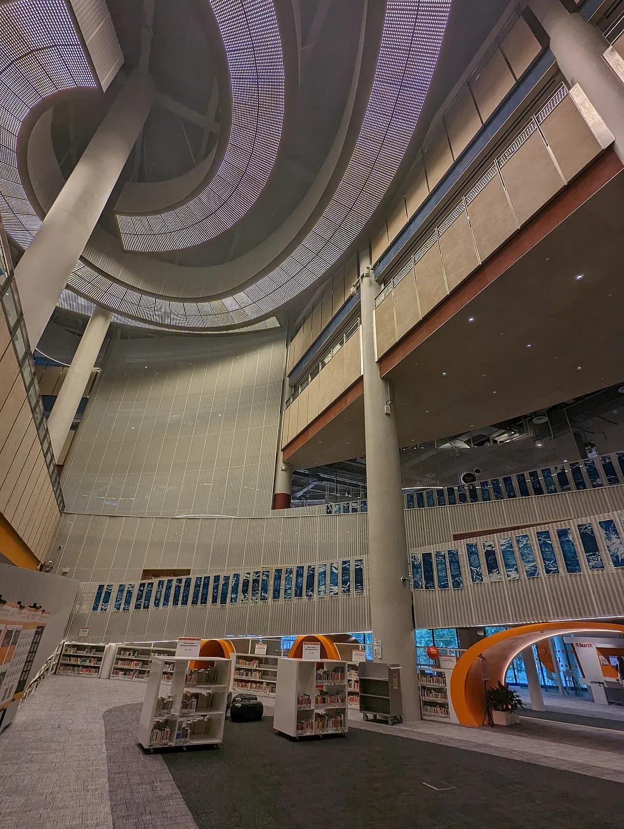 The multilevel interior of Punggol Regional Library viewed from the ground floor.